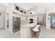 Modern kitchen with white cabinets and a large island at 276 Long Meadow Ln, Rotonda West, FL 33947