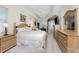 Main bedroom with a king-size bed, wooden furniture, and access to a balcony at 276 Long Meadow Ln, Rotonda West, FL 33947