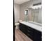 Bathroom with double vanity and large mirror at 294 Rotonda Cir, Rotonda West, FL 33947