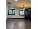 Bright bedroom with dark hardwood floors and modern lighting at 294 Rotonda Cir, Rotonda West, FL 33947