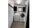 Laundry room with washer, dryer, and storage shelves at 294 Rotonda Cir, Rotonda West, FL 33947