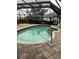 Kidney-shaped pool with covered patio at 294 Rotonda Cir, Rotonda West, FL 33947