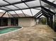 Kidney-shaped pool with covered patio at 294 Rotonda Cir, Rotonda West, FL 33947