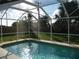 Inviting screened pool with a tranquil atmosphere at 3159 Pinetree St, Port Charlotte, FL 33952