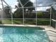 Refreshing screened pool perfect for relaxation at 3159 Pinetree St, Port Charlotte, FL 33952