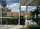 Peaceful screened patio overlooking backyard at 3159 Pinetree St, Port Charlotte, FL 33952