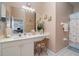 Bathroom with a vanity area, decorative paintings and tile accents at 3323 Grand Vista Ct # 201, Port Charlotte, FL 33953