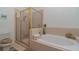 Bathroom featuring soaking tub, shower stall and tile accents at 3323 Grand Vista Ct # 201, Port Charlotte, FL 33953