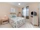 Cozy bedroom with bright natural light, plantation shutters and decorative trim at 3323 Grand Vista Ct # 201, Port Charlotte, FL 33953