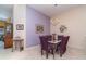 Dining area with purple accent wall and a chandelier illuminating the table at 3323 Grand Vista Ct # 201, Port Charlotte, FL 33953