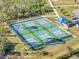 Aerial view of pickleball courts, offering a vibrant recreational space within the community at 3323 Grand Vista Ct # 201, Port Charlotte, FL 33953