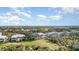 Aerial view of community with homes near golf course at 3353 Grand Vista Ct # 202, Port Charlotte, FL 33953