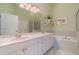 Double vanity bathroom with a large soaking tub and shower at 3353 Grand Vista Ct # 202, Port Charlotte, FL 33953