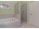 Bathroom with shower and separate tub, bright and airy at 3353 Grand Vista Ct # 202, Port Charlotte, FL 33953