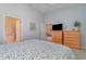 Spacious bedroom with king-size bed and ensuite bathroom access at 3353 Grand Vista Ct # 202, Port Charlotte, FL 33953