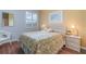 Guest bedroom with full-size bed and window seat at 3353 Grand Vista Ct # 202, Port Charlotte, FL 33953