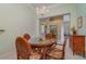 Bright dining room features a glass-top table and wicker chairs at 3353 Grand Vista Ct # 202, Port Charlotte, FL 33953