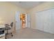 Home office with built-in cabinetry and access to kitchen at 3353 Grand Vista Ct # 202, Port Charlotte, FL 33953