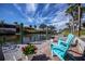 Relaxing waterfront patio area with two chairs and beautiful canal views at 367 Englewood Isles Pkwy # 4, Englewood, FL 34223