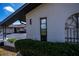 Partial view of house exterior, showing a window and landscaping at 367 Englewood Isles Pkwy # 4, Englewood, FL 34223