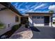 Single-story home with attached garage, brick paver walkway, and landscaping at 367 Englewood Isles Pkwy # 4, Englewood, FL 34223