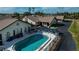 Community pool with lounge chairs and umbrellas; inviting outdoor space at 367 Englewood Isles Pkwy # 4, Englewood, FL 34223