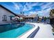 Community pool with ample lounge chairs and umbrellas at 367 Englewood Isles Pkwy # 4, Englewood, FL 34223