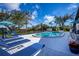 Inviting pool area with lounge chairs and lush landscaping at 367 Englewood Isles Pkwy # 4, Englewood, FL 34223