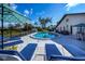 Relaxing poolside view with lounge chairs and umbrellas at 367 Englewood Isles Pkwy # 4, Englewood, FL 34223