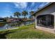 Stunning canal-front view with private dock and lush landscaping at 367 Englewood Isles Pkwy # 4, Englewood, FL 34223