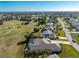 This aerial view shows the home's screened pool area and golf course frontage at 40 Bunker Pl, Rotonda West, FL 33947