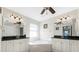 Bathroom featuring dual sinks, marble counters, and a soaking tub at 40 Bunker Pl, Rotonda West, FL 33947