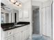 Bathroom featuring a granite vanity, glass shower, and neutral color palette at 40 Bunker Pl, Rotonda West, FL 33947