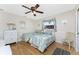 Charming bedroom with two twin beds, ceiling fan, and decorative accents at 40 Bunker Pl, Rotonda West, FL 33947