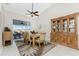 Open dining area with a high ceiling, ceiling fan, and a clear view of the outdoors at 40 Bunker Pl, Rotonda West, FL 33947