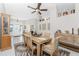 A dining room featuring a wooden table, chairs, cabinets, and stylish decor at 40 Bunker Pl, Rotonda West, FL 33947