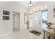 Bright foyer with tiled flooring and a transom window above the front door at 40 Bunker Pl, Rotonda West, FL 33947