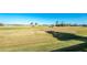 Panoramic view of the lush green golf course with manicured greens and mature palm trees at 40 Bunker Pl, Rotonda West, FL 33947