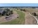 Aerial view of the golf course, showing the lush green fairways and manicured greens at 40 Bunker Pl, Rotonda West, FL 33947