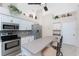 Bright kitchen featuring stainless steel appliances and stone countertops at 40 Bunker Pl, Rotonda West, FL 33947