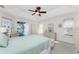 Spacious main bedroom featuring a ceiling fan, and a view of the pool at 40 Bunker Pl, Rotonda West, FL 33947