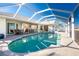 Sparkling screened-in pool with ample patio space, ideal for relaxation and entertaining at 40 Bunker Pl, Rotonda West, FL 33947