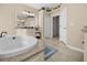 Bright bathroom featuring a soaking tub and double vanity at 411 Boundary Blvd, Rotonda West, FL 33947