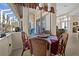 Cozy breakfast nook with wicker chairs and view of the backyard at 411 Boundary Blvd, Rotonda West, FL 33947