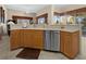 Kitchen boasts a large island with seating and dishwasher at 411 Boundary Blvd, Rotonda West, FL 33947