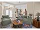 Comfortable living room with green sofas and a hexagonal coffee table at 411 Boundary Blvd, Rotonda West, FL 33947