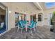 Covered patio with seating area and ceiling fan at 411 Boundary Blvd, Rotonda West, FL 33947