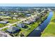 Wide angle aerial view of neighborhood with canal waterfront homes and landscaped streets at 429 Rotonda Cir, Rotonda West, FL 33947