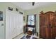 Bedroom with a closet, an antique armoire and a stained-glass lamp at 429 Rotonda Cir, Rotonda West, FL 33947