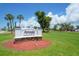 Sign for Rotonda Golf and Country Club, Hills Restaurant + Hills Course, surrounded by landscaping at 429 Rotonda Cir, Rotonda West, FL 33947